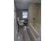 Standard bathroom with a tub and shower combo, toilet, and sink with mirror in neutral tones at 927 Locke St, Salisbury, NC 28144