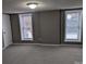 Comfortable bedroom with plush carpet, neutral walls, and windows allowing ample natural light at 927 Locke St, Salisbury, NC 28144