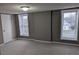 Comfortable bedroom with plush carpet, neutral walls, and windows allowing ample natural light at 927 Locke St, Salisbury, NC 28144