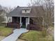 Charming single Gathering home with a brick foundation, covered porch, and well-maintained landscaping at 927 Locke St, Salisbury, NC 28144