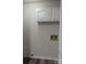 Functional laundry room with storage cabinets above the hookups and a convenient floor drain at 927 Locke St, Salisbury, NC 28144
