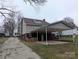 Image showing the rear exterior of the home with a covered carport and access to the backyard at 927 Locke St, Salisbury, NC 28144