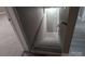 Carpeted staircase leading downwards, featuring a handrail for safety and a view of lower level flooring at 927 Locke St, Salisbury, NC 28144