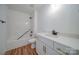 Bathroom featuring a white vanity, matching shower-tub, and wood-look flooring at 0000 Trull Hinson Rd # 1, Wingate, NC 28174