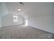 Bright bedroom boasts plush carpeting, white walls, and natural light from a window at 0000 Trull Hinson Rd # 1, Wingate, NC 28174