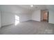 A spacious room featuring plush carpeting, white walls, and natural light at 0000 Trull Hinson Rd # 1, Wingate, NC 28174