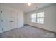 Bedroom offers natural light, plush carpeting, and a double door closet at 0000 Trull Hinson Rd # 1, Wingate, NC 28174