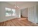Dining room with wood floors, chandelier, and large window with ample natural light at 0000 Trull Hinson Rd # 1, Wingate, NC 28174
