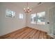 Dining room with wood floors, neutral paint, a modern chandelier, and lots of natural light at 0000 Trull Hinson Rd # 1, Wingate, NC 28174