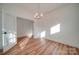 Bright dining room with wood floors, elegant chandelier, and french doors at 0000 Trull Hinson Rd # 1, Wingate, NC 28174