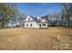 Charming white two-story home featuring black trim and roof situated on a spacious lot at 0000 Trull Hinson Rd # 1, Wingate, NC 28174