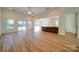 Open-concept living room with wood floors and sliding doors to the backyard at 0000 Trull Hinson Rd # 1, Wingate, NC 28174