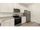 Well-equipped kitchen featuring granite countertops, stainless steel appliances, and white cabinets at 102 Lightning Dr, Shelby, NC 28152