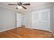 Bedroom with wood floors, crown moulding, ceiling fan and double closets at 104 N Hawthorne St, Mount Holly, NC 28120