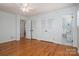 The main bedroom features hardwood floors, ceiling fan, closet space, and an attached bathroom at 104 N Hawthorne St, Mount Holly, NC 28120