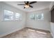 Cozy sunroom with large windows offering ample natural light and neutral tiling at 104 N Hawthorne St, Mount Holly, NC 28120