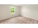 Bright bedroom features plush carpet and natural light streaming through the window at 108 Lightning Dr, Shelby, NC 28152