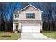 Charming two-story home featuring a two-car garage, neutral siding, and a welcoming front entrance at 108 Lightning Dr, Shelby, NC 28152