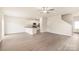 Bright open-concept living area with modern laminate floors and a view into the kitchen at 108 Lightning Dr, Shelby, NC 28152