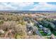 An aerial view of a neighborhood with tree-lined streets and well-maintained homes at 10829 Carmody Ct, Charlotte, NC 28277
