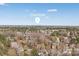 An aerial view of the city of Charlotte, with a neighborhood in the foreground at 10829 Carmody Ct, Charlotte, NC 28277