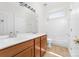 Bright bathroom featuring double sinks with a vanity and a shower-tub combination is a functional and practical space at 10829 Carmody Ct, Charlotte, NC 28277