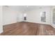 Spacious bedroom with two windows for ample natural light and view to the ensuite bathroom with white marble at 10829 Carmody Ct, Charlotte, NC 28277