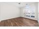 Well lit bedroom with a view and a ceiling fan to keep you cool during hot summer nights at 10829 Carmody Ct, Charlotte, NC 28277