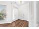 Bright entryway with hardwood floors, white trim and traditional style at 10829 Carmody Ct, Charlotte, NC 28277