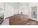Living room with a fireplace, access to the bathroom, as well as a large window at 10829 Carmody Ct, Charlotte, NC 28277
