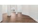 Open concept living area featuring hardwood floors and modern finishes at 10829 Carmody Ct, Charlotte, NC 28277