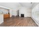 Bright living room featuring a fireplace, ceiling fan, and large windows offering natural light and a view at 10829 Carmody Ct, Charlotte, NC 28277