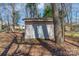 An exterior view of a shed with double doors in the backyard at 10829 Carmody Ct, Charlotte, NC 28277