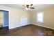 Cozy living room with hardwood floors, natural light, and a decorative fireplace adding a touch of elegance at 112 E Elliott St, Fort Mill, SC 29715