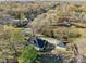 Scenic aerial view of property and surrounding neighborhood with mature trees at 1135 Old Charlotte Rd, Concord, NC 28027