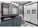 Modern bathroom with double sinks, granite counters, and a tiled walk-in shower at 1135 Old Charlotte Rd, Concord, NC 28027