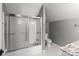 Bathroom showcasing shower stall with glass doors and marble-top vanity at 1135 Old Charlotte Rd, Concord, NC 28027