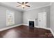 Inviting bedroom with hardwood floors, a fireplace, and natural light at 1135 Old Charlotte Rd, Concord, NC 28027