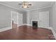 Spacious bedroom featuring hardwood floors, a fireplace, and neutral paint colors at 1135 Old Charlotte Rd, Concord, NC 28027