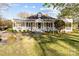 Charming home featuring a wide porch, well-maintained landscaping, and a classic architectural style at 1135 Old Charlotte Rd, Concord, NC 28027