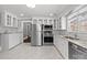 Updated kitchen featuring white cabinets, granite countertops, and stainless appliances at 1135 Old Charlotte Rd, Concord, NC 28027
