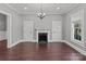 Inviting living room with fireplace, hardwood floors, and neutral color palette at 1135 Old Charlotte Rd, Concord, NC 28027