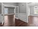 Bright living room featuring hardwood floors, french doors, and neutral paint at 1135 Old Charlotte Rd, Concord, NC 28027