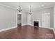 Spacious living room with hardwood floors, fireplace, and neutral color palette at 1135 Old Charlotte Rd, Concord, NC 28027