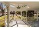 View of white gazebo featuring decorative trim, chandelier, and outdoor views at 1135 Old Charlotte Rd, Concord, NC 28027