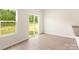 Bright living area with sliding glass door, natural light and vinyl floors at 119 Lightning Dr, Shelby, NC 28152