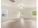 Spacious main bedroom featuring vinyl floors, three windows and neutral paint at 119 Lightning Dr, Shelby, NC 28152