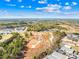 A drone shot of a construction site surrounded by mature trees, ready for new development at 121 Winners Cir # 2, Mooresville, NC 28117