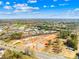 An aerial view of the construction site nestled amidst a backdrop of trees and clear blue skies at 121 Winners Cir # 2, Mooresville, NC 28117