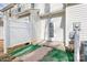 Backyard with white fence, artificial grass, gravel, and white door to home at 12417 Mcgrath Dr, Charlotte, NC 28269